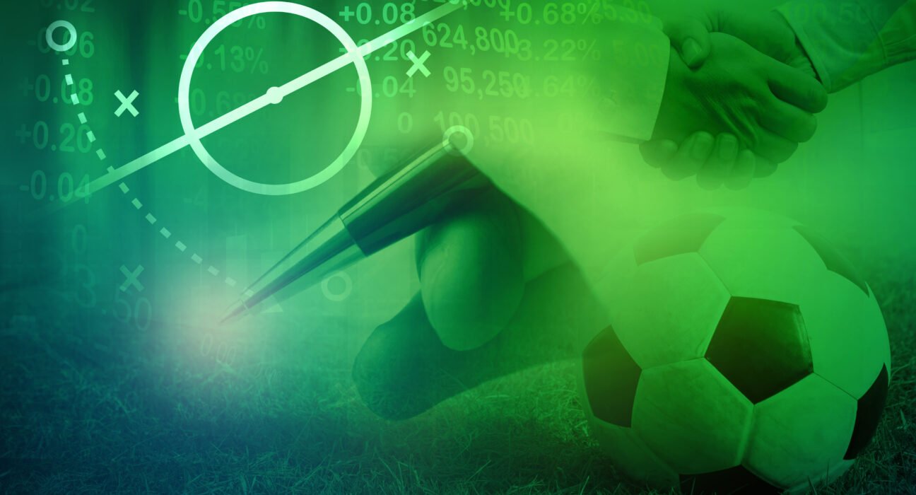 Football with football player hand to sign contract , soccer tra